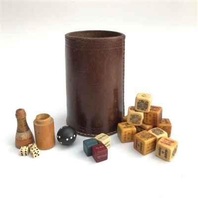 Lot 2701 - A leather dice cup and a collection of dice...