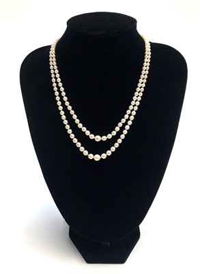 Lot 2474 - A double strand graduated pearl necklace, the...