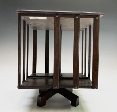 Lot 3138 - An oak revolving table bookcase, with label...