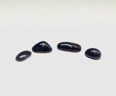 Lot 56 - Four cabochon garnets 12.8gm