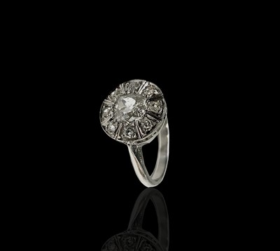 Lot 146 - A white gold or platinum ring with a circular...