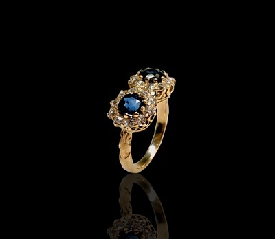 Lot 19 - A yellow gold double diamond and sapphire...