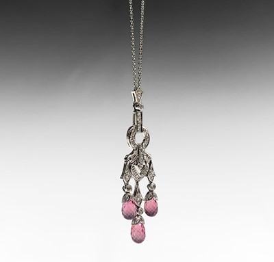 Lot 66 - An 18ct white gold pendant and chain set with...