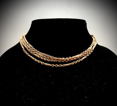 Lot 651 - A 10ct gold long guard with spiral bar links...