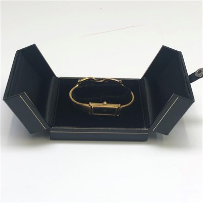 Lot 2584 - A ladies Gucci gilt wristwatch.