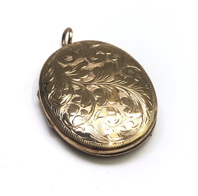 Lot 2592 - A large engraved 9ct gold locket, 23.9g.
