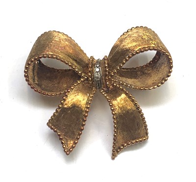 Lot 2596 - An Italian 18ct gold bow brooch tied with a...