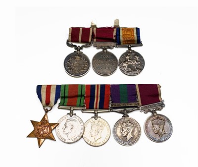 Lot 210 - A Meritorious service family group to the...