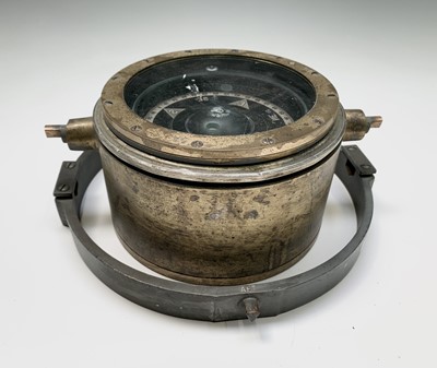 Lot 49 - A brass ship's compass, stamped to the edge...