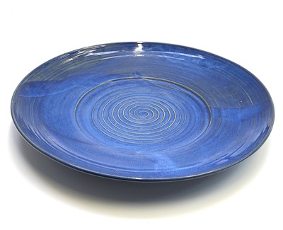 Lot 997 - A large blue studio pottery shallow dish,...