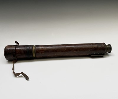 Lot 57 - A military brass and leather bound single draw...