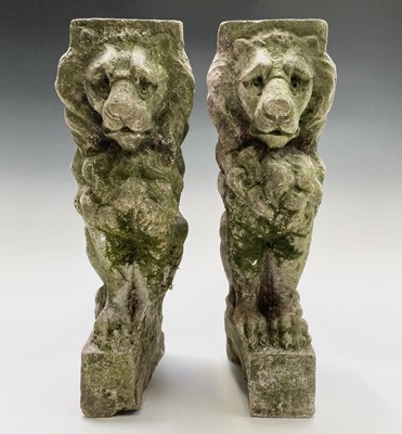 Lot 618 - A pair of cast stone seated lion garden bench...