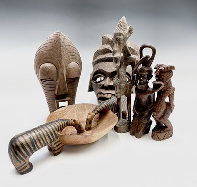 Lot 87 - An African tribal hardwood mask, carved with...