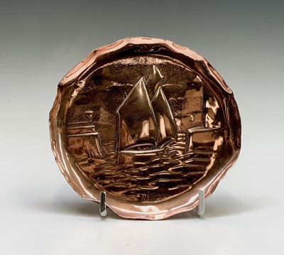 Lot 3 - A Newlyn copper small circular tray, repousse...