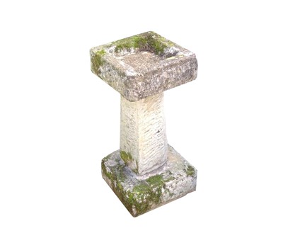 Lot 607 - A composition stone bird bath. Height 63cm,...