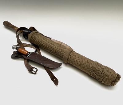 Lot 89 - An ash baton, length 68cm, in a container with...