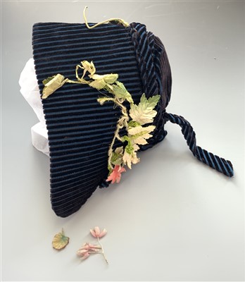 Lot 3220 - A 19th century child's bonnet in blue & black...