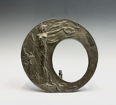 Lot 25 - An Art Nouveau metal photo frame cast with a...