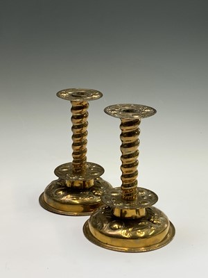 Lot 11 - A pair of brass candlesticks, circa 1900,...