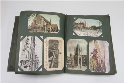 Lot 59 - An early 20th century postcard album and...