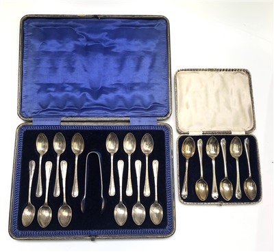 Lot 2161 - Set of 12 silver coffee spoons and tongs in...