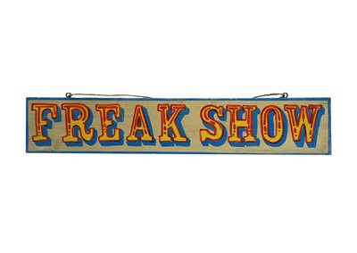 Lot 121 - A signwritten wooden sign 'FREAK SHOW', having...