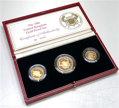Lot 2513 - A rare gold 1986 proof three coin set, boxed...