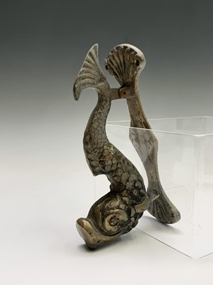 Lot 122 - A brass door knocker modelled as a dolphin....