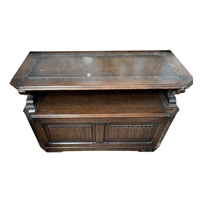 Lot 3355 - An oak monks bench, 20th century, with linen...