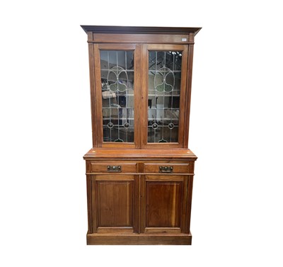 Lot 3044 - An Art nouveau walnut bookcase, with a pair of...