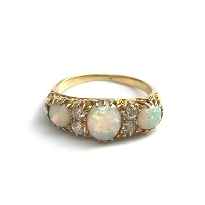 Lot 2757 - A late Victorian gold ring set with 3 opals,...