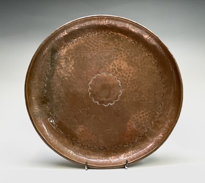 Lot 107 - A Newlyn copper shallow dish with a planished...