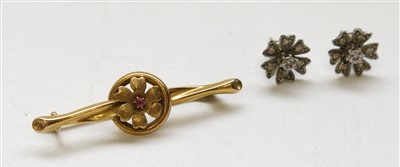 Lot 2768 - A pair of white gold flower head earrings and...