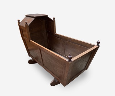 Lot 53 - An elm crib, early 20th century, with a...