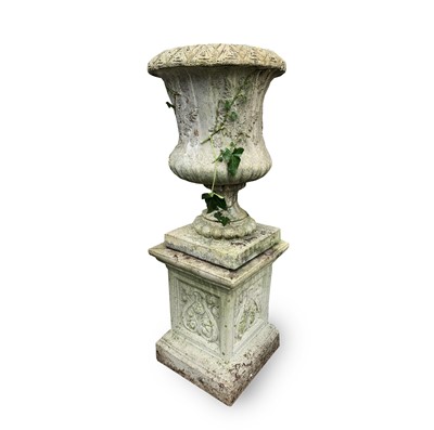 Lot 606 - A reconstituted stone garden urn of campana...