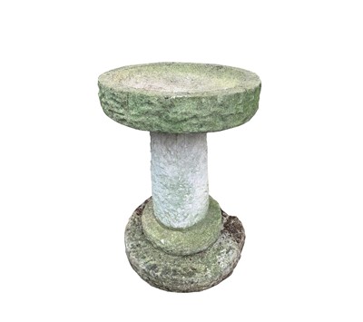 Lot 617 - A composition stone bird bath, the circular...