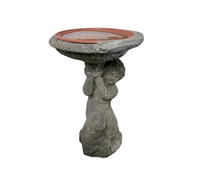 Lot 652 - A composite stone bird bath, the column...