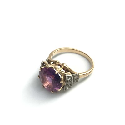 Lot 2772 - An 18ct gold ring set a pink stone with...