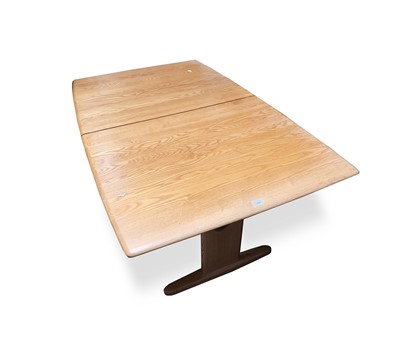 Lot 3056 - An Ercol light elm extending dining table,...