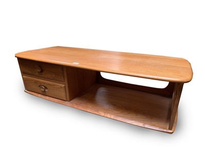 Lot 3060 - An Ercol light elm Minerva long rectangular...