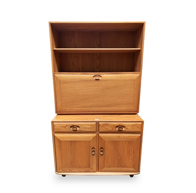 Lot 3061 - An Ercol light elm drinks cabinet, fitted with...
