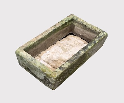 Lot 639 - A carved stone trough planter of rectangular...