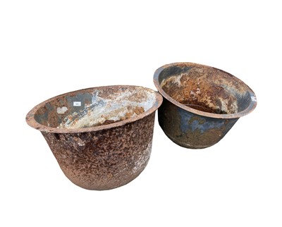 Lot 608 - A near pair of cast iron cauldrons. Both...