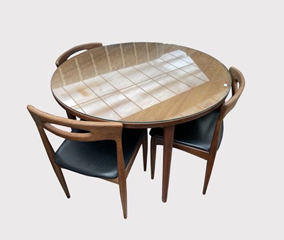 Lot 3038 - A Danish teak dining table and a set of four...