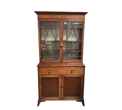 Lot 3100 - A mahogany two part cabinet, 19th century, the...