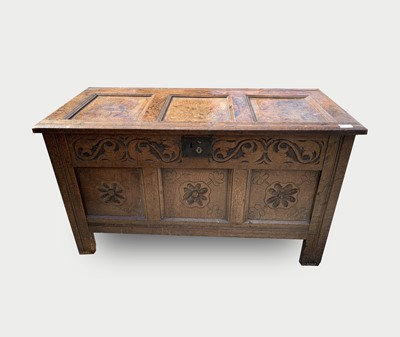 Lot 21 - A carved oak coffer, 17th century, with a...