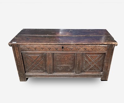Lot 42 - A carved oak coffer, 17th century, with arch...