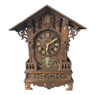 Lot 3033 - A black forest oak cuckoo mantel clock, late...