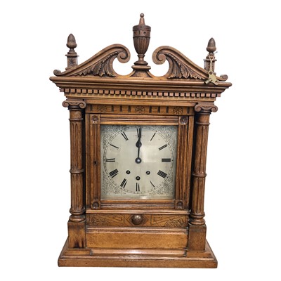 Lot 3040 - A German oak cased mantel clock, late 19th...