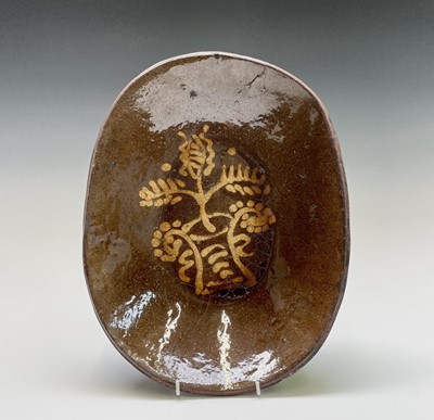 Lot 97 - A slipware baking dish, circa 1760, decorated...